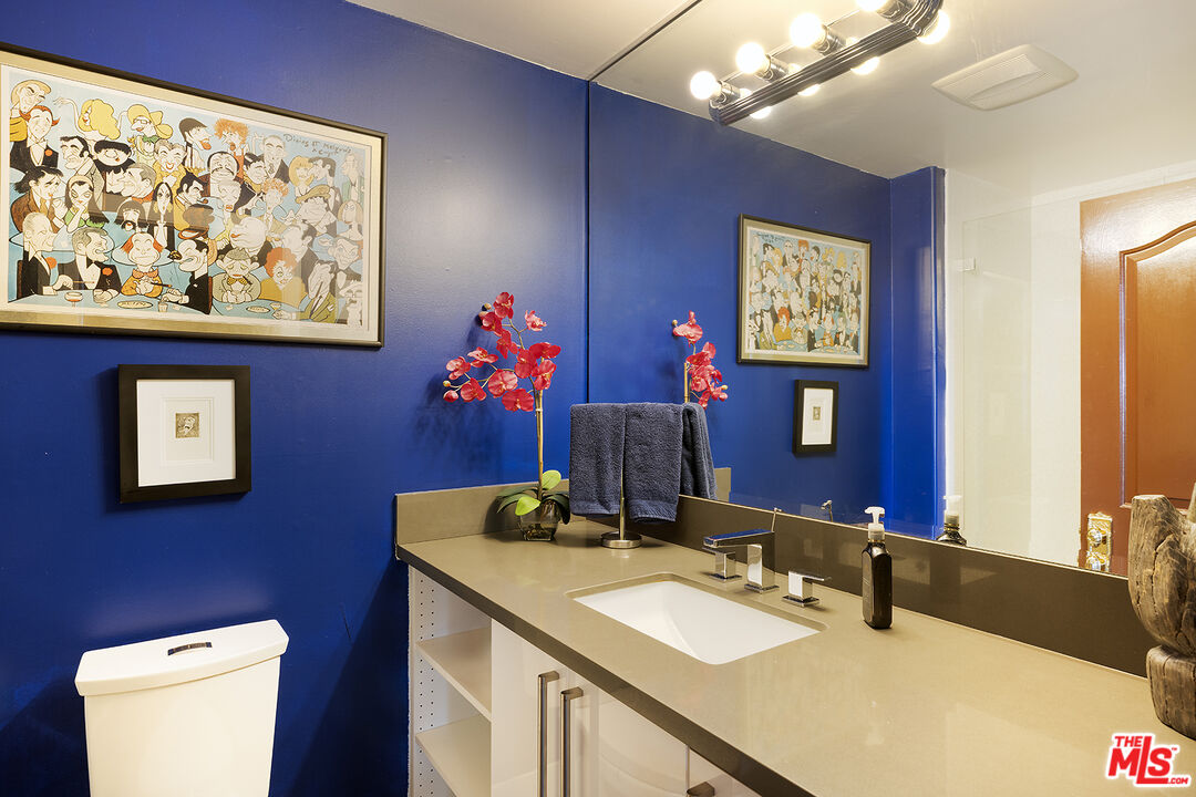960 North Doheny Drive, Unit 306 West Hollywood, CA 90069 - Photo 24 of 31 a bathroom with a sink and a mirror