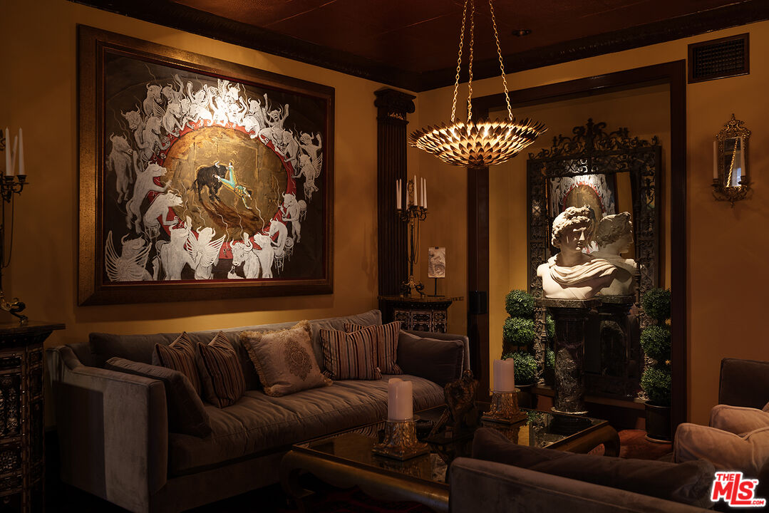 960 North Doheny Drive, Unit 306 West Hollywood, CA 90069 - Photo 27 of 31 a living room with furniture a chandelier and a painting