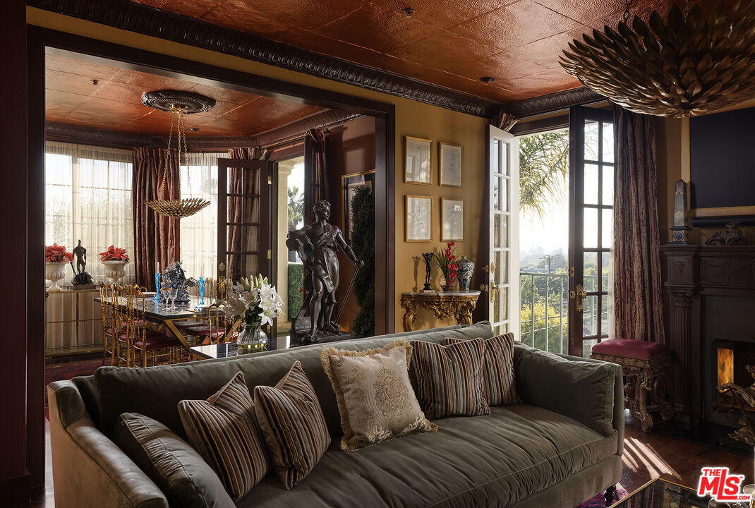 960 North Doheny Drive, Unit 306 West Hollywood, CA 90069 - Photo 3 of 31 a living room with furniture and a large window
