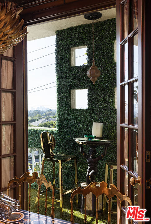 960 North Doheny Drive, Unit 306 West Hollywood, CA 90069 - Photo 6 of 31 a front view of a house with outdoor seating and city view