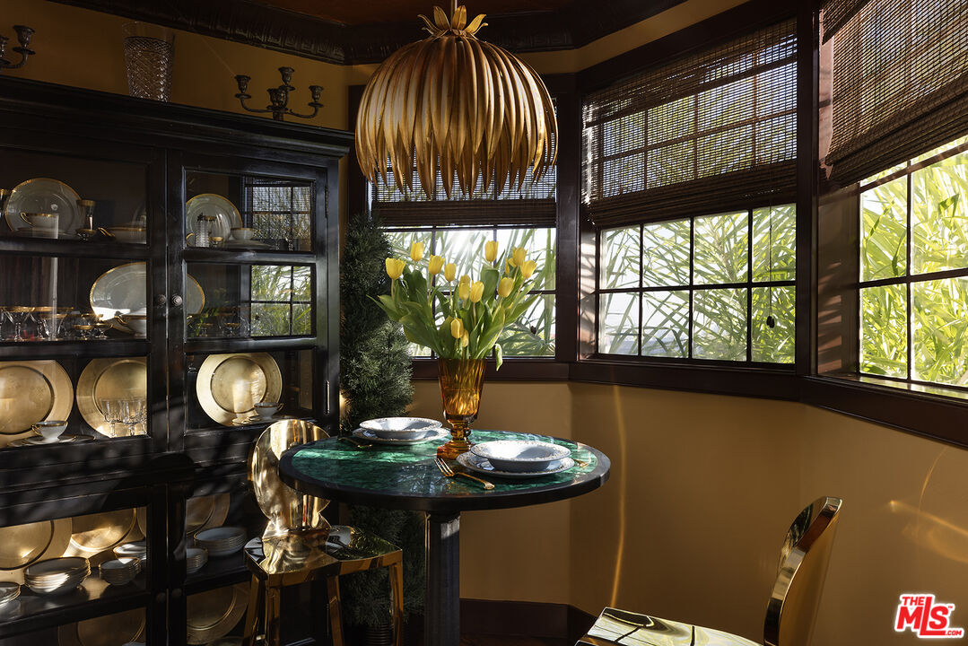 960 North Doheny Drive, Unit 306 West Hollywood, CA 90069 - Photo 8 of 31 a view of a dining room with furniture window and outside view