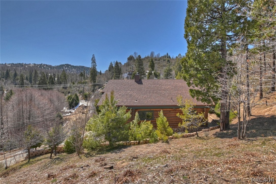 29632 Hook Creek Road Cedar Glen, CA 92321 - Photo 38 of 43 a view of a house with a yard and sitting area