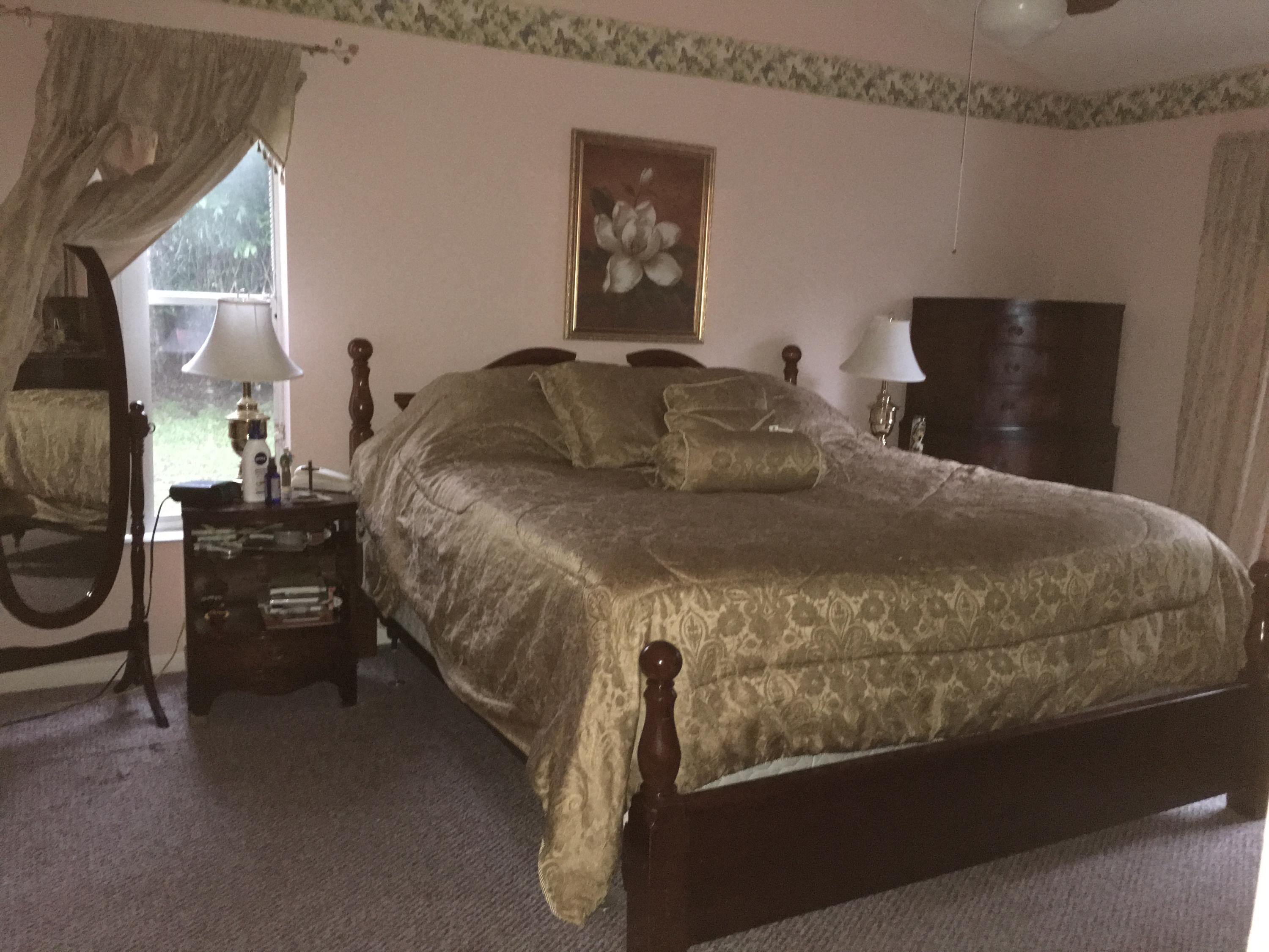 22146 Candle Court Boca Raton, FL 33428 - Photo 5 of 24 a bed sitting in a bedroom next to a window