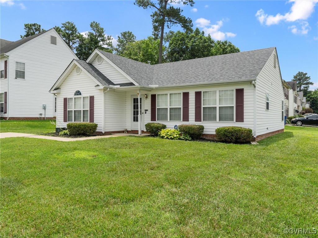View of front of home with roof with shingles and