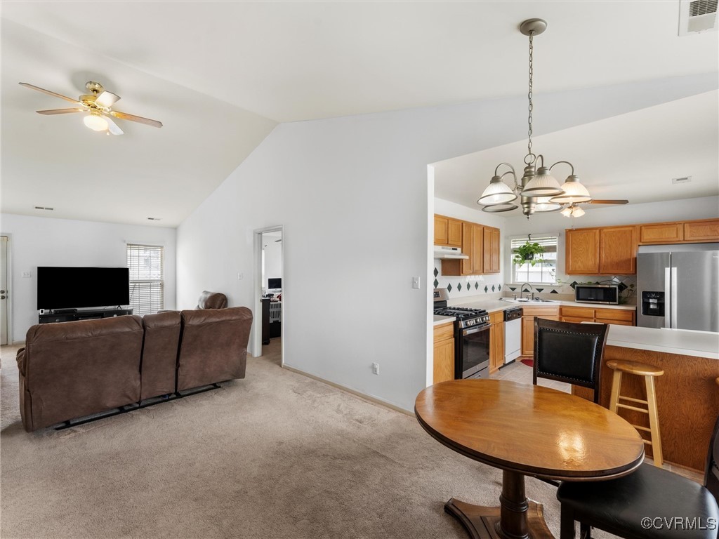 3043 Amherst Ridge Way Colonial Heights, VA 23834 - Photo 16 of 27 Dining space featuring vaulted ceiling and a chand