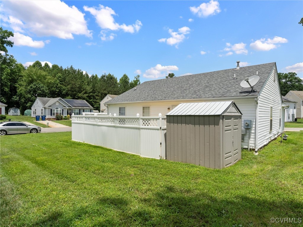 3043 Amherst Ridge Way Colonial Heights, VA 23834 - Photo 27 of 27 View of grassy yard featuring a storage unit