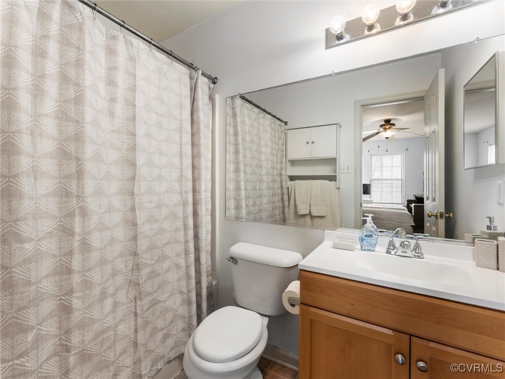 Full bathroom featuring vanity and ceiling fan