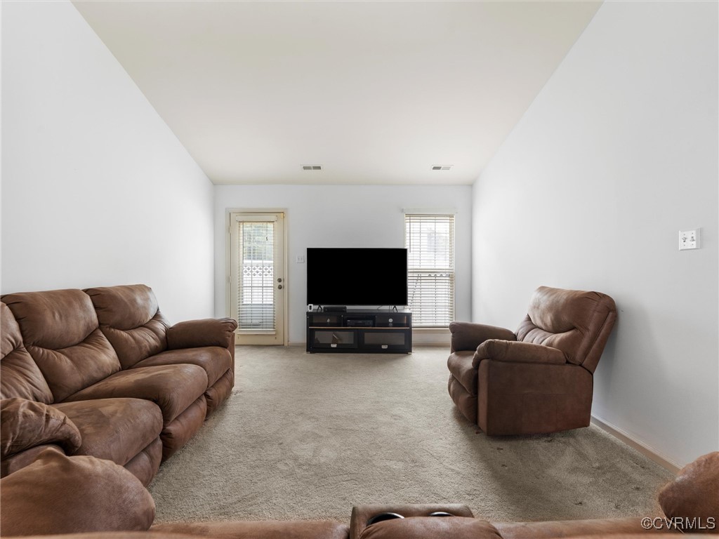 3043 Amherst Ridge Way Colonial Heights, VA 23834 - Photo 9 of 27 Carpeted living area featuring lofted ceiling