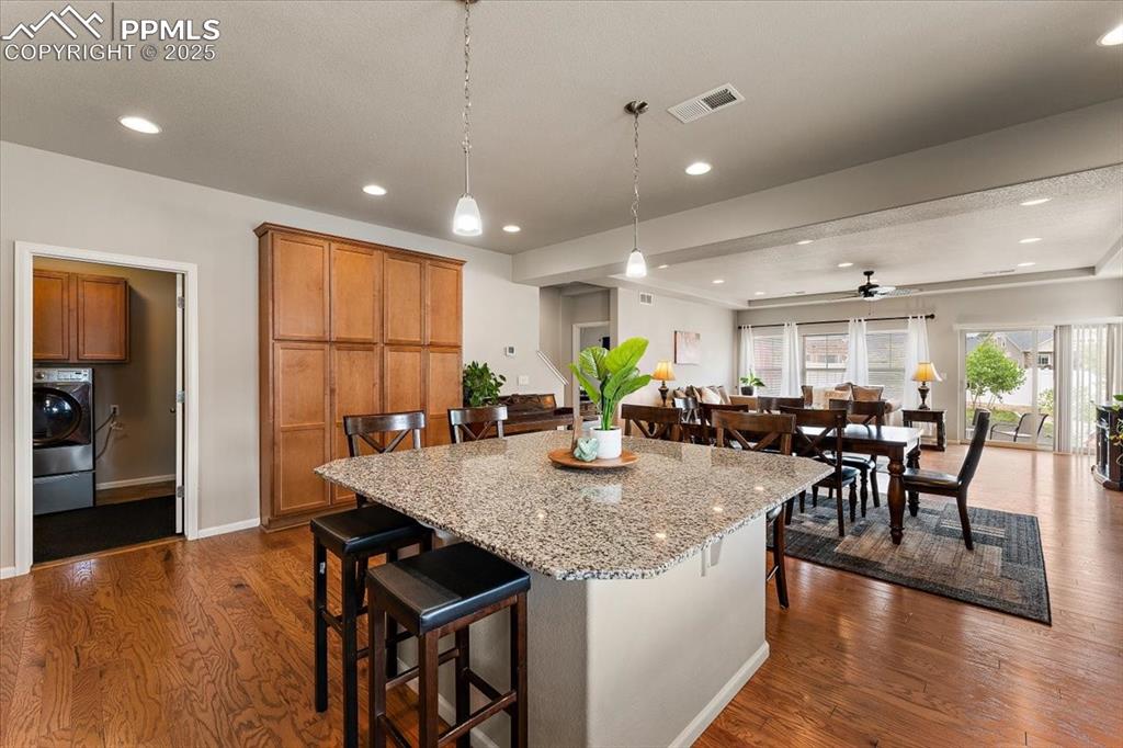 7890 Treehouse Terrace Fountain, CO 80817 - Photo 4 of 31 a view of a dining room with furniture and wooden floor