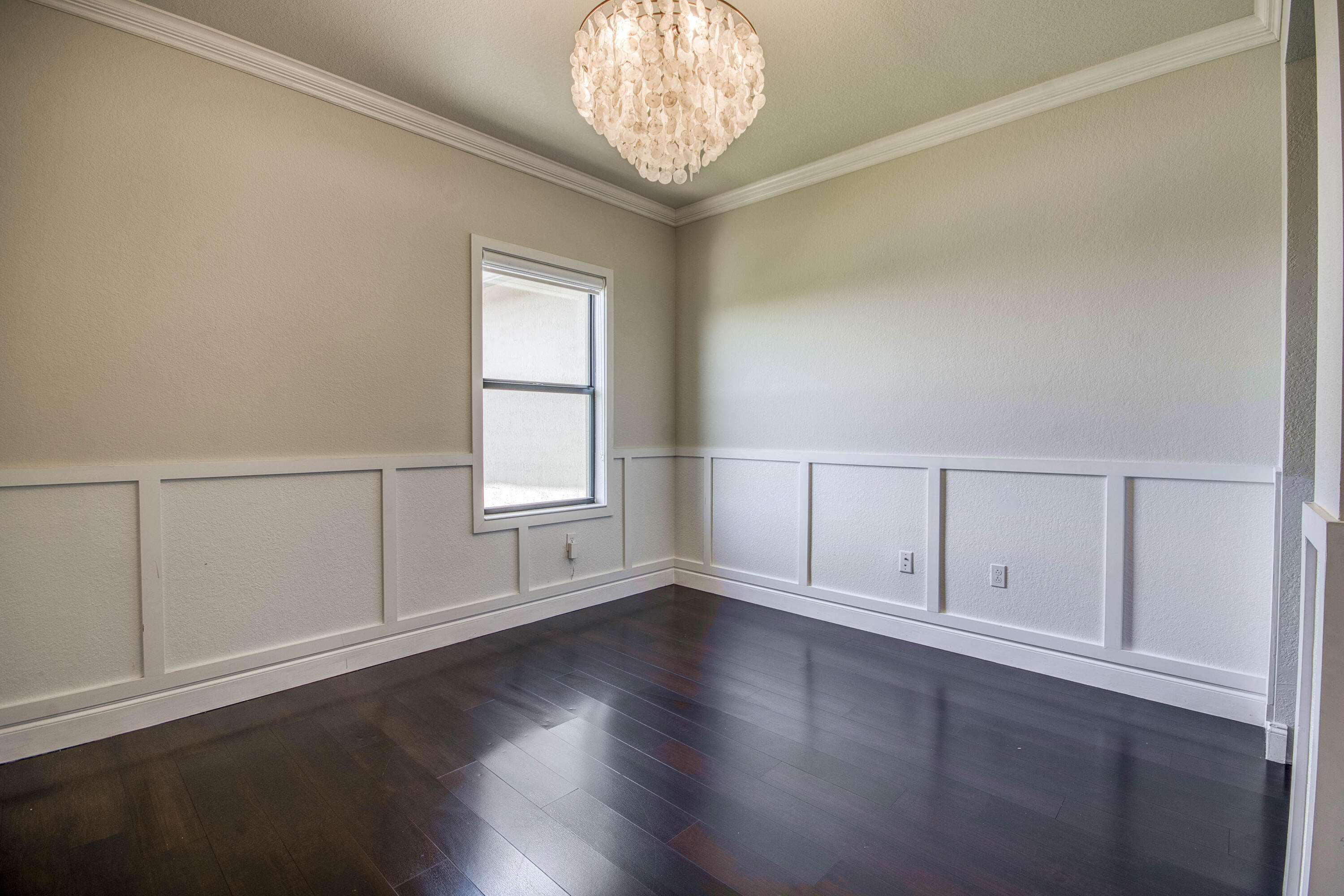 8301 Rearing Lane Lake Worth, FL 33467 - Photo 29 of 33 an empty room with wooden floor cabinet and windows