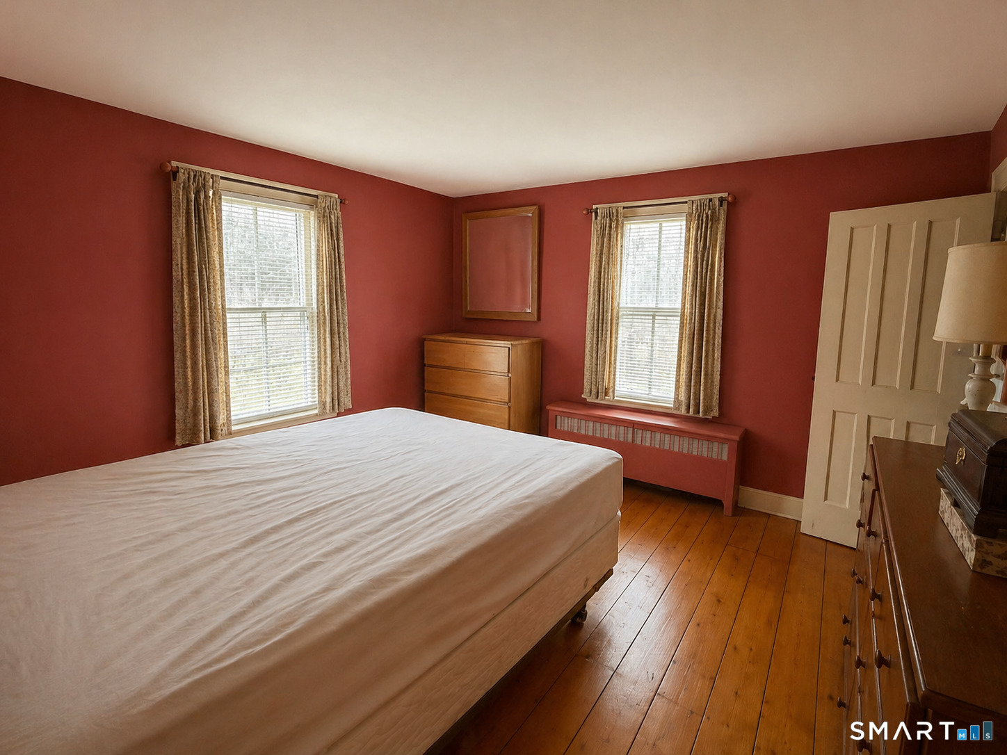 21 High Bridge Road Newtown, CT 06482 - Photo 11 of 14 a bedroom with a bed and a flat tv screen on dresser