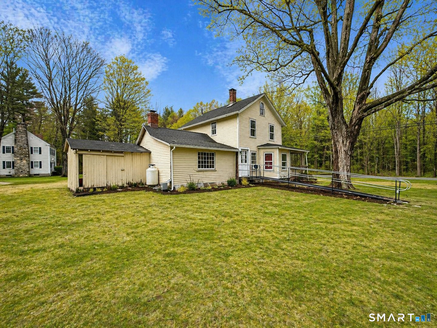 21 High Bridge Road Newtown, CT 06482 - Photo 2 of 14 a house view with a garden space