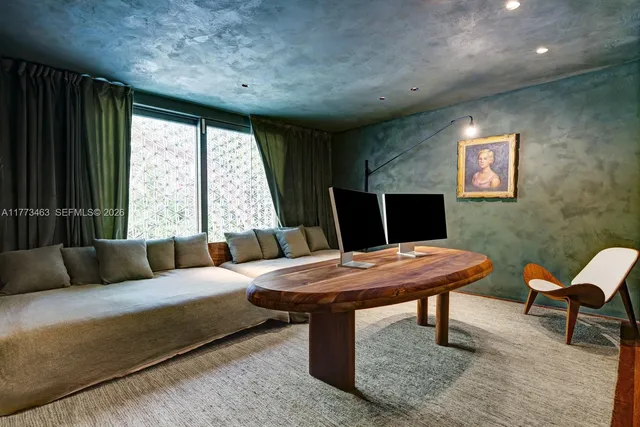 a living room with furniture and a window