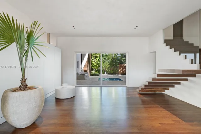 a view of an entryway and livingroom with furniture