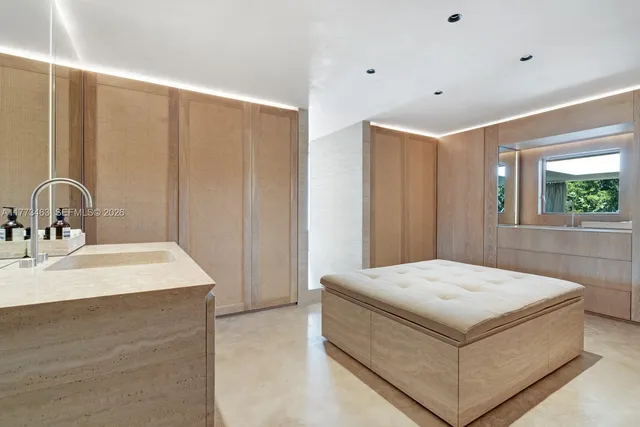 a room with a bed and a sink