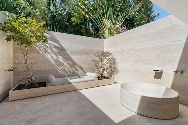 a view of a brick house with large windows