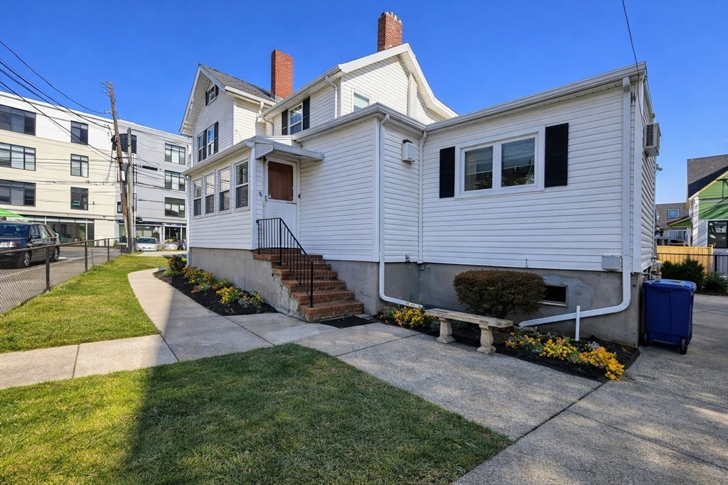 198 Washington Street, Unit 1 Somerville, MA 02143 - Photo 14 of 15 a view of a house with backyard and sitting area