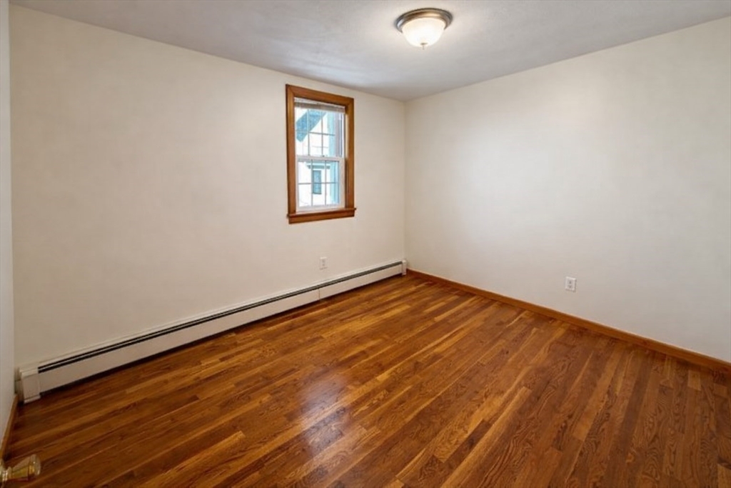 198 Washington Street, Unit 1 Somerville, MA 02143 - Photo 10 of 15 an empty room with a window