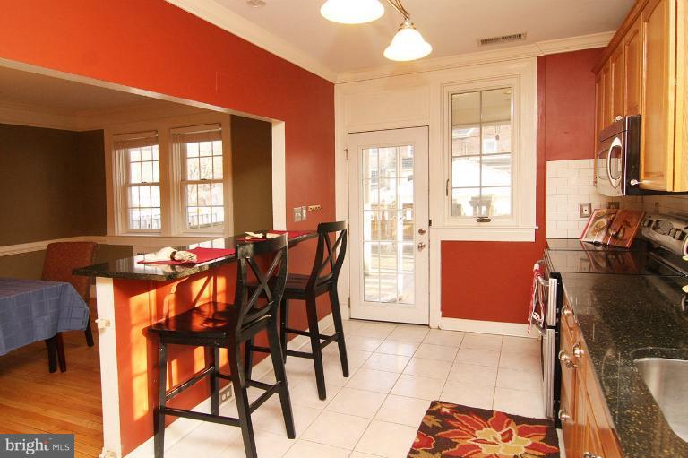 330 Hopkins Road Baltimore, MD 21212 - Photo 13 of 30 a view of a dining room with furniture and a window