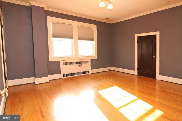 330 Hopkins Road Baltimore, MD 21212 - Photo 28 of 30 an empty room with wooden floor and windows