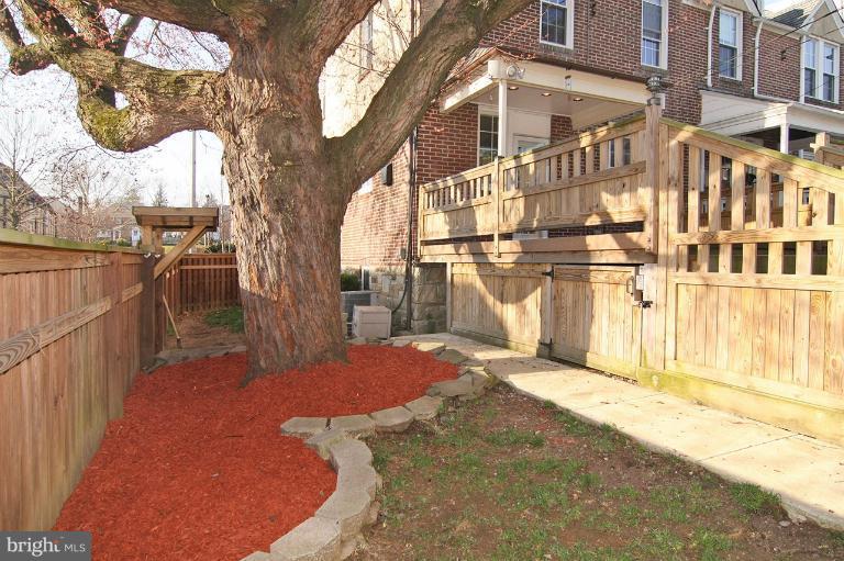 330 Hopkins Road Baltimore, MD 21212 - Photo 6 of 30 a view of a porch with a tree