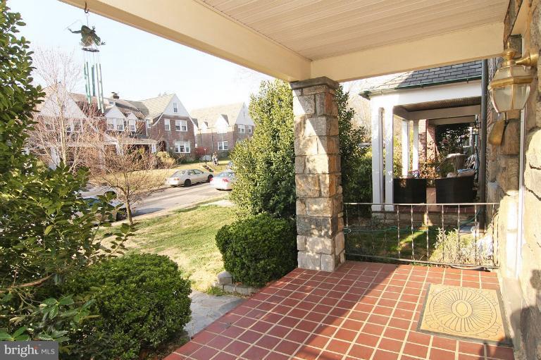 330 Hopkins Road Baltimore, MD 21212 - Photo 9 of 30 a view of a porch with a floor to ceiling window and wooden fence