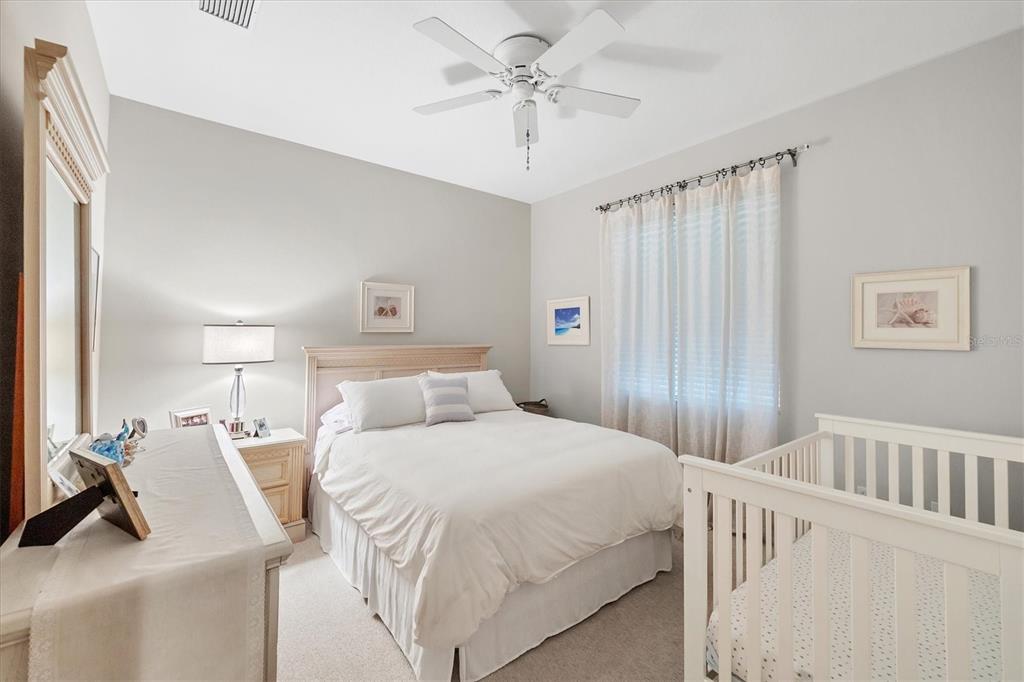4 Windward Way Placida, FL 33946 - Photo 32 of 39 a bedroom with a bed and a chandelier