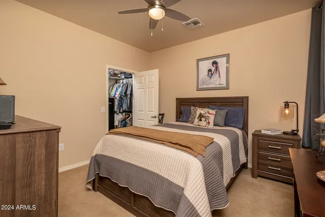 a bedroom with a bed and cabinets