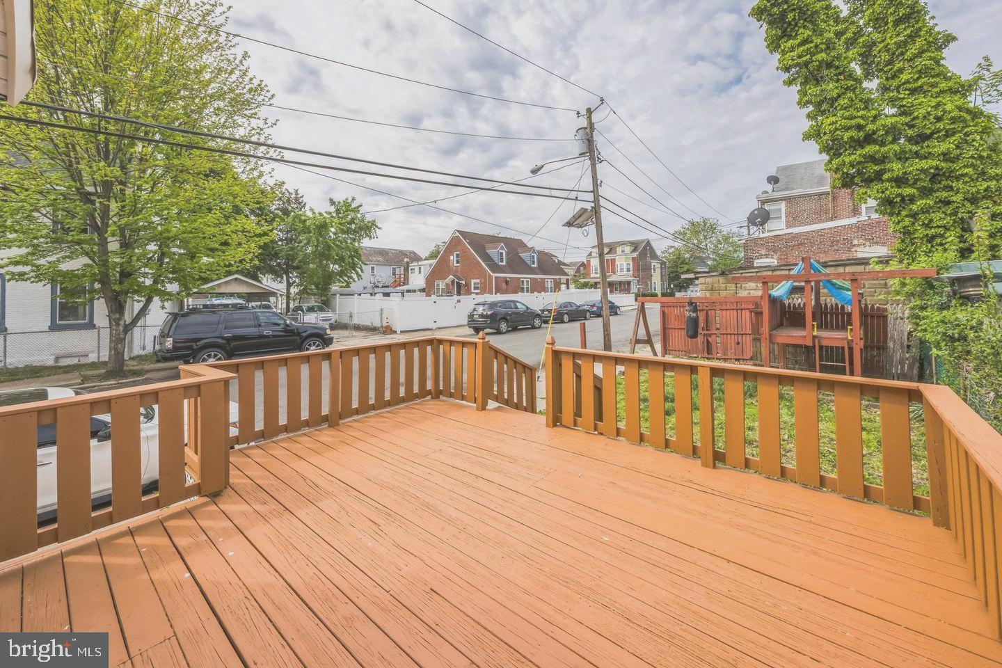131 Columbus Avenue Trenton, NJ 08629 - Photo 11 of 12 a view of balcony with wooden floor and fence