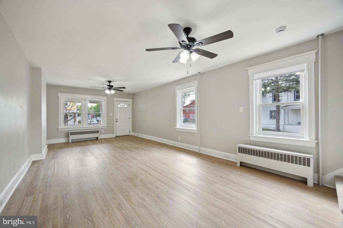 131 Columbus Avenue Trenton, NJ 08629 - Photo 4 of 12 a view of livingroom with hardwood floor and window