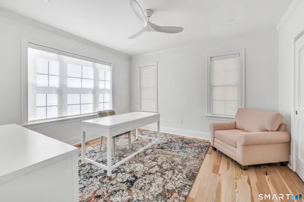 a living room with furniture and a window
