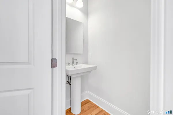a bathroom with a sink and mirror