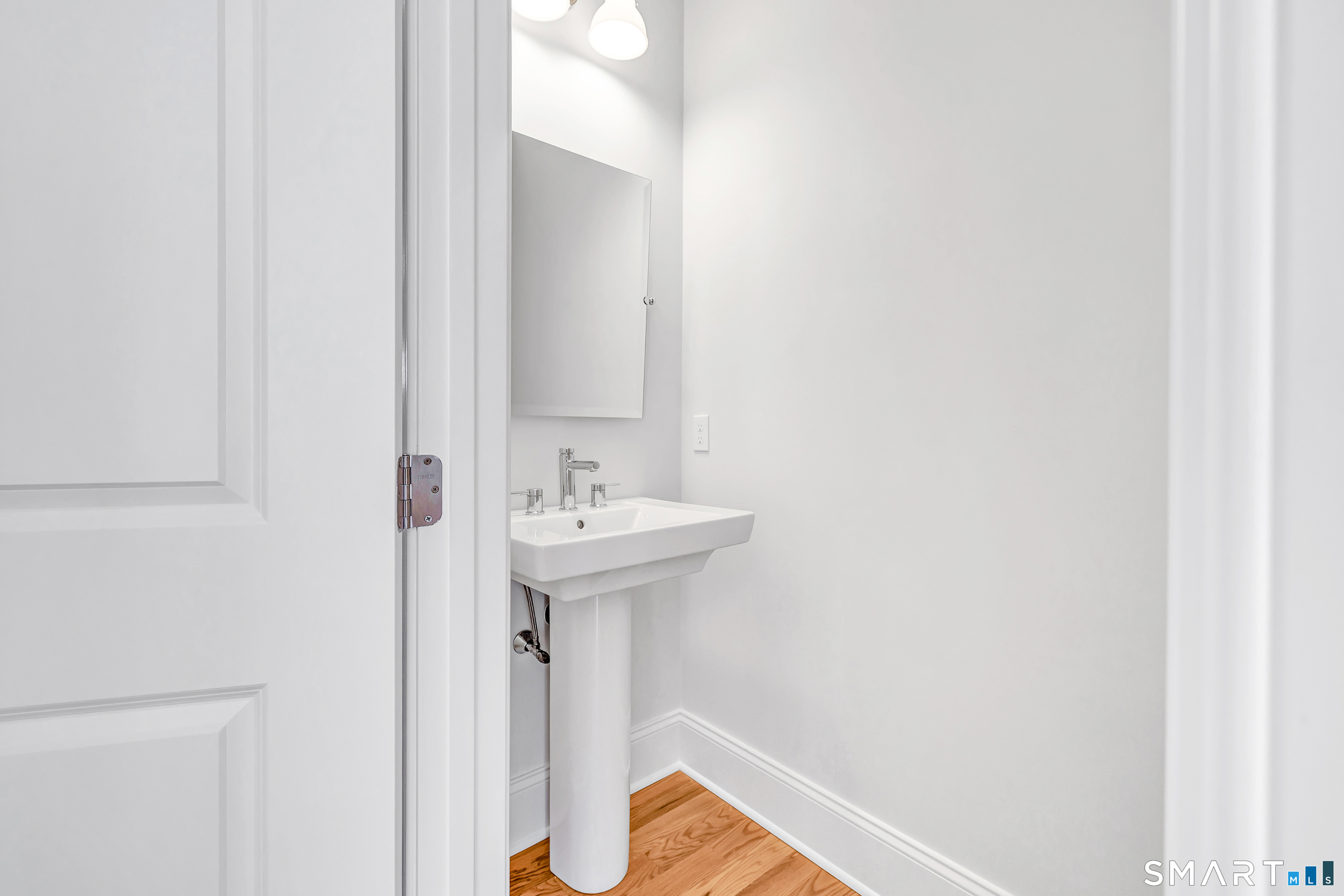 20 Winthrop Woods Road Shelton, CT 06484 - Photo 8 of 9 a bathroom with a sink and mirror