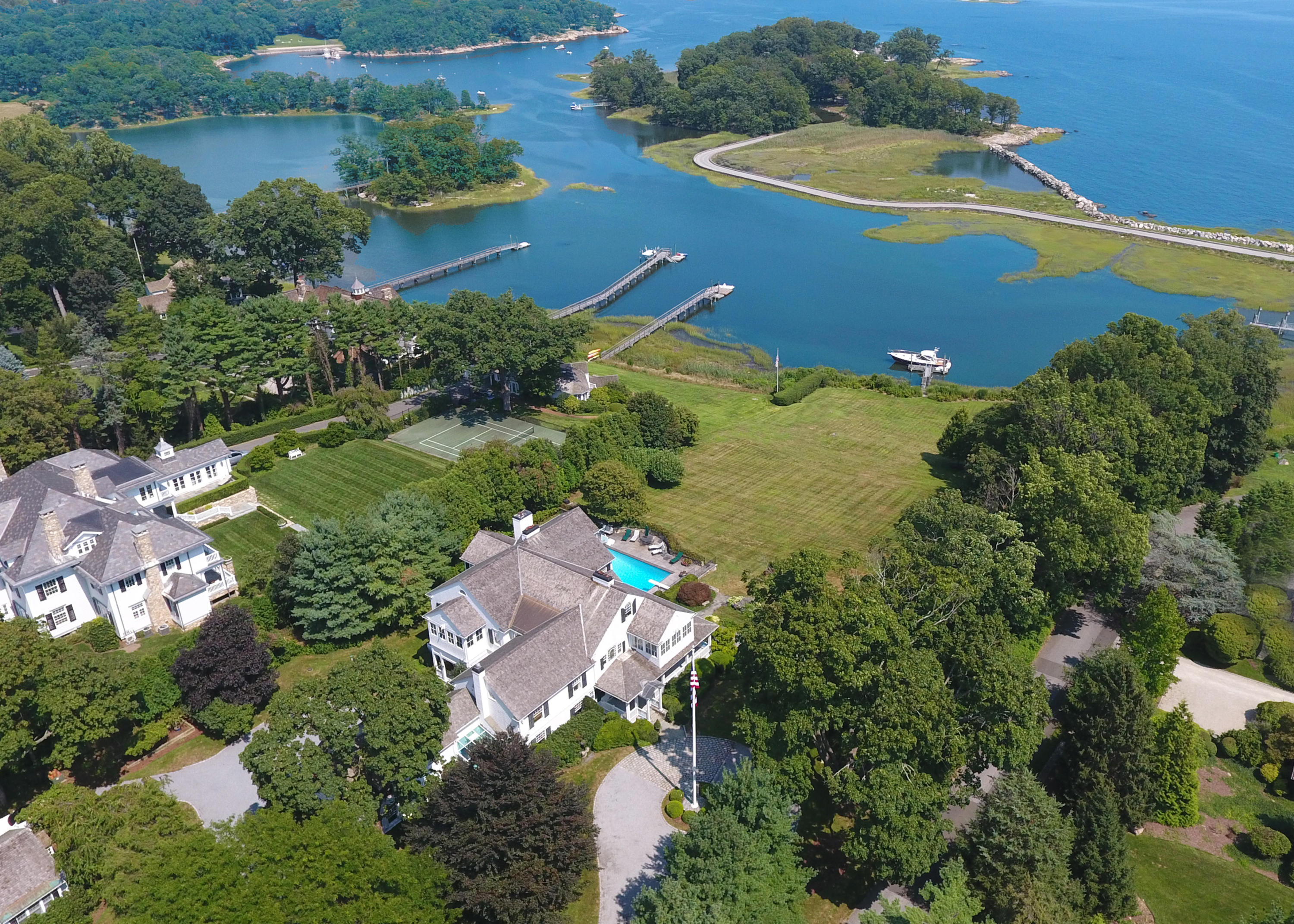155 Long Neck Point Road Darien, CT 06820 - Photo 1 of 52 an aerial view of a house with a yard