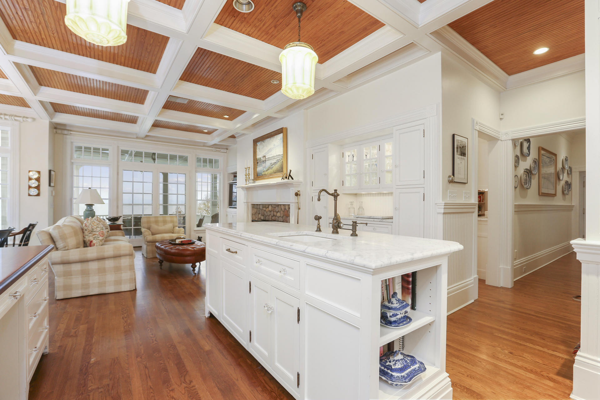 155 Long Neck Point Road Darien, CT 06820 - Photo 18 of 52 a large white kitchen with a large window appliances and wooden floor
