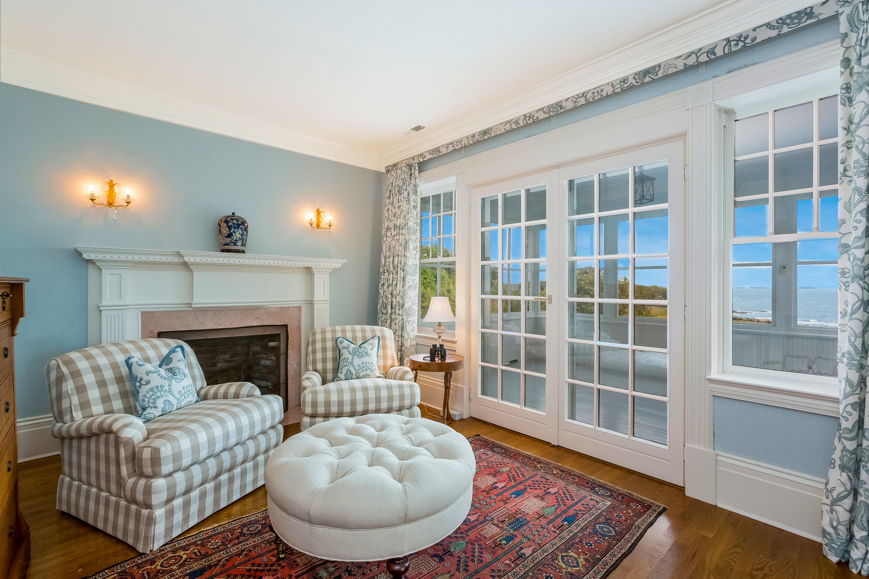 155 Long Neck Point Road Darien, CT 06820 - Photo 24 of 52 a living room with furniture and a fireplace