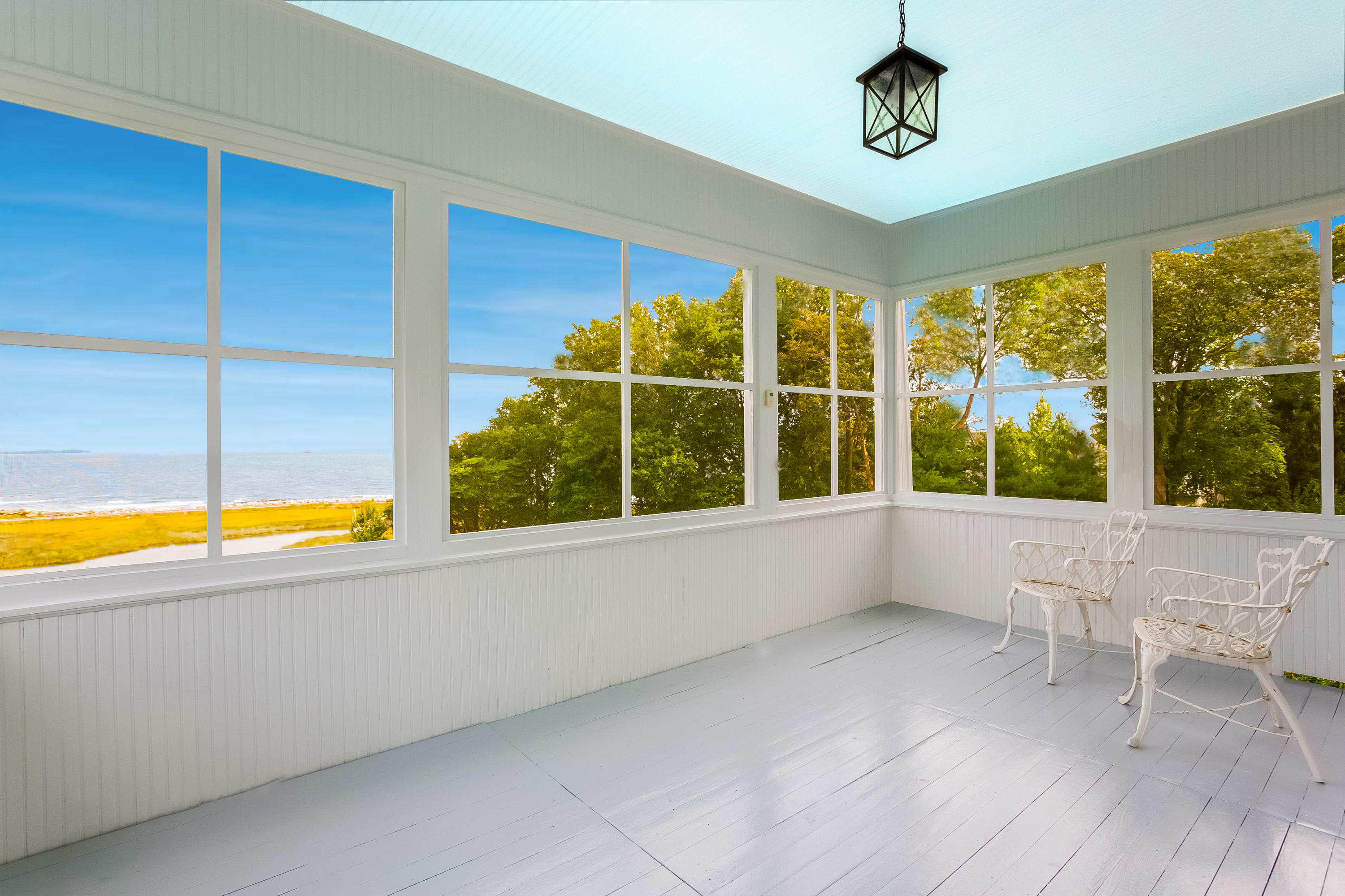 155 Long Neck Point Road Darien, CT 06820 - Photo 25 of 52 a view of a room with window a ceiling fan and wooden floor