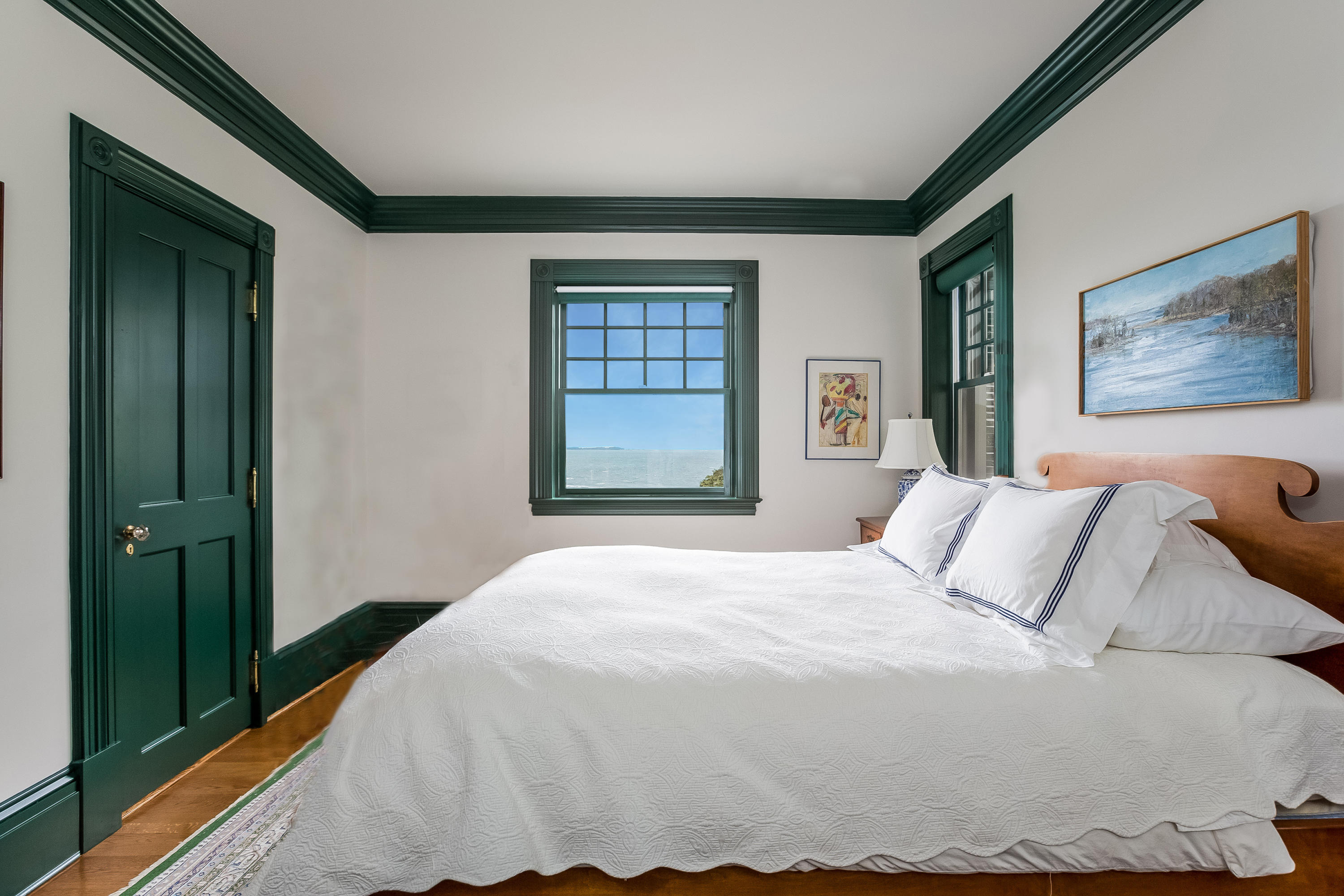 155 Long Neck Point Road Darien, CT 06820 - Photo 28 of 52 a bedroom with a bed and a painting on the wall