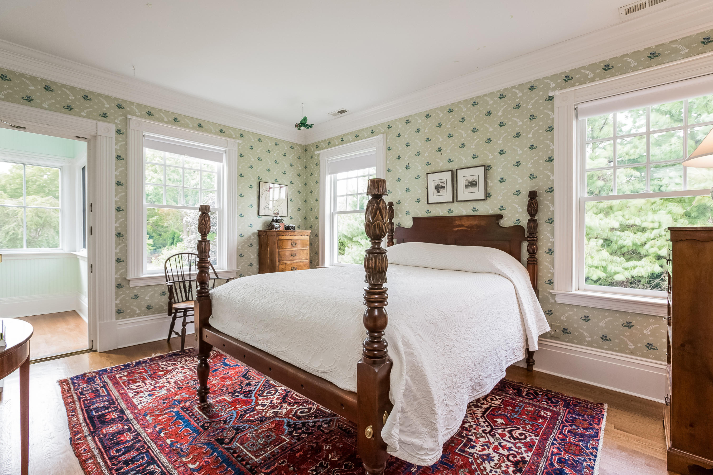 155 Long Neck Point Road Darien, CT 06820 - Photo 30 of 52 a bed sitting in a bedroom next to a window