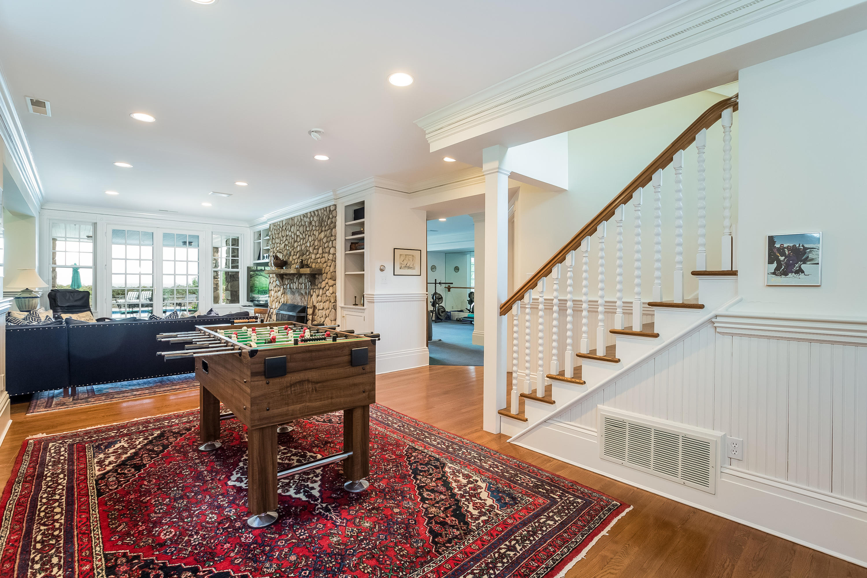 155 Long Neck Point Road Darien, CT 06820 - Photo 31 of 52 a living room with furniture fireplace and rug