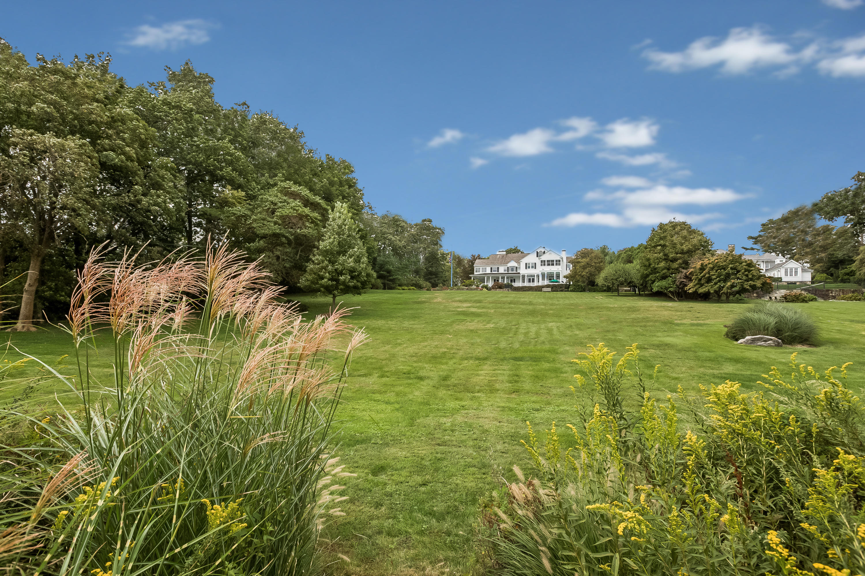 155 Long Neck Point Road Darien, CT 06820 - Photo 36 of 52 a view of yard with swimming pool and green space