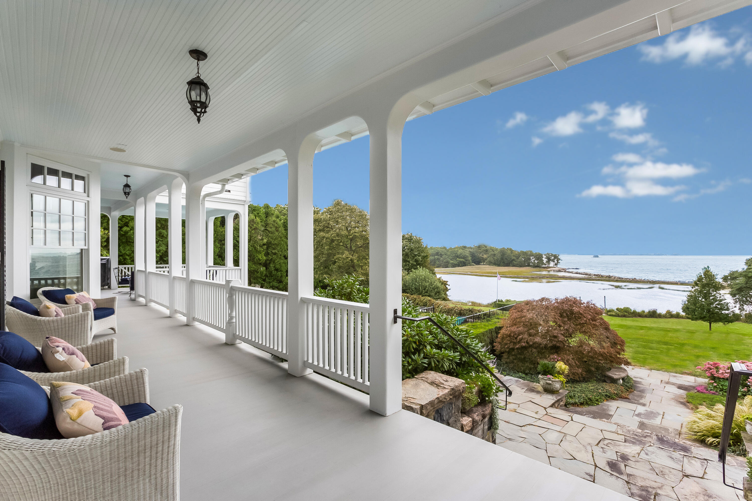 155 Long Neck Point Road Darien, CT 06820 - Photo 37 of 52 a living room with furniture floor to ceiling window and yard