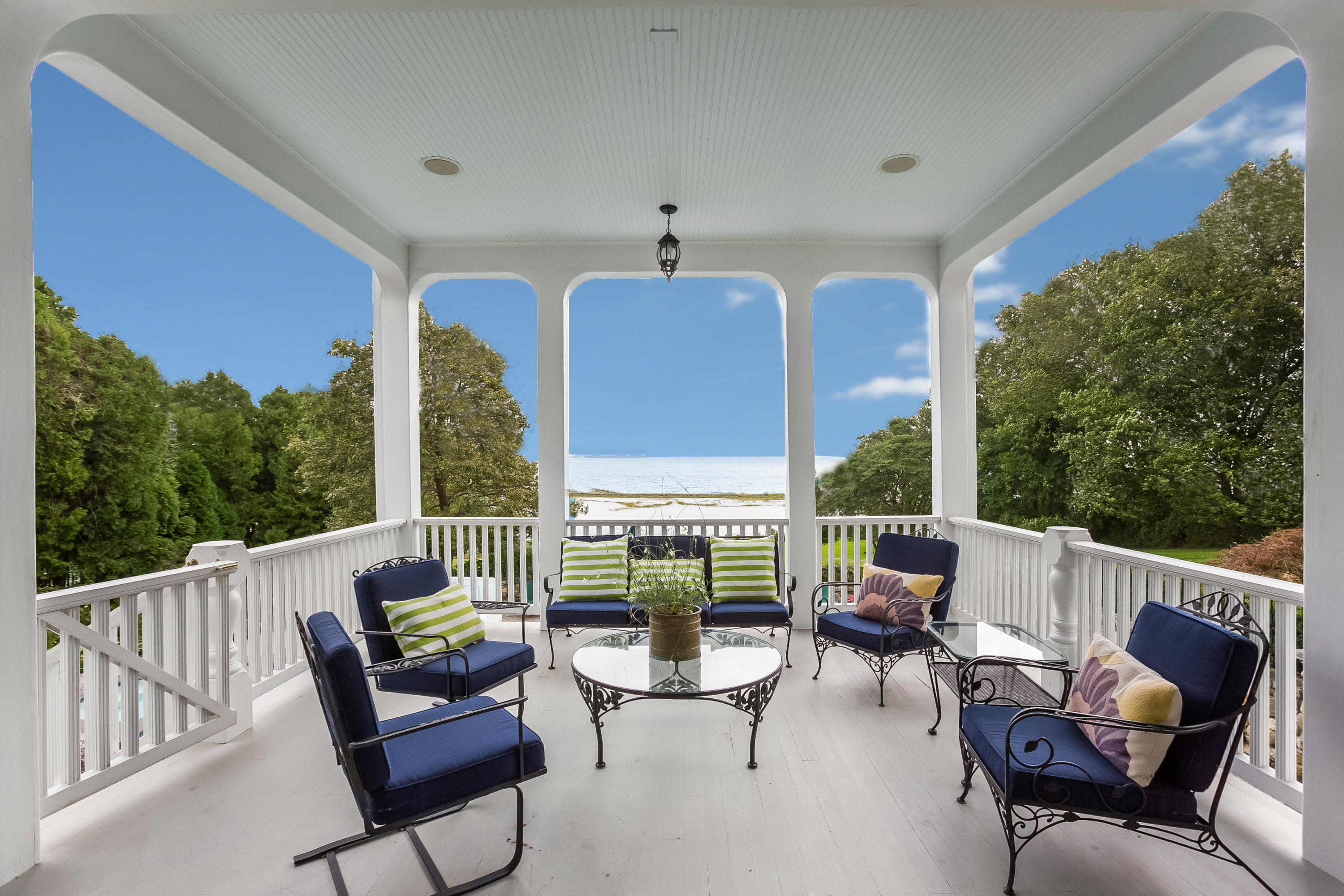 155 Long Neck Point Road Darien, CT 06820 - Photo 38 of 52 a balcony with outdoor seating and plants