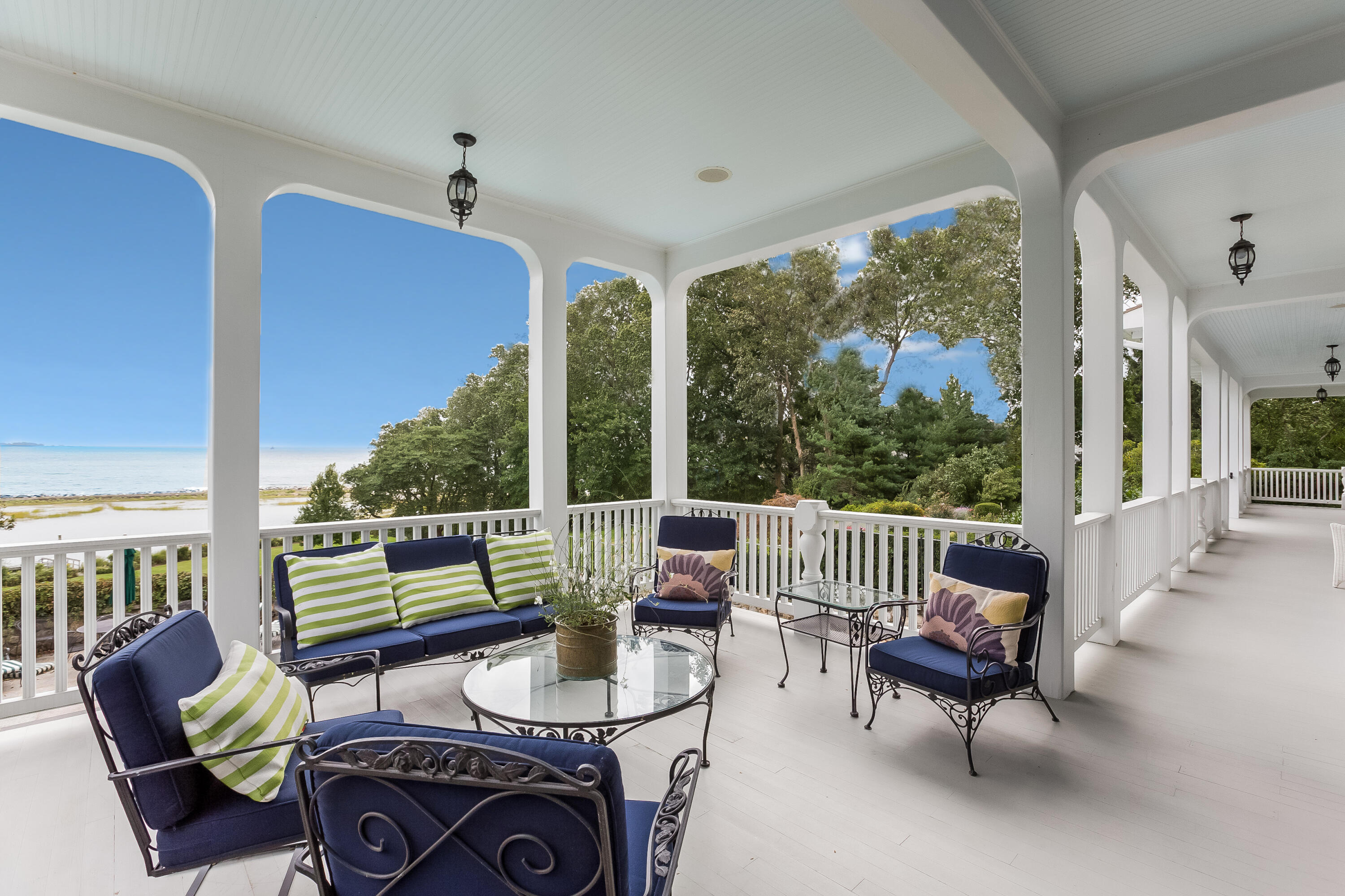 155 Long Neck Point Road Darien, CT 06820 - Photo 39 of 52 a living room with furniture and a floor to ceiling window