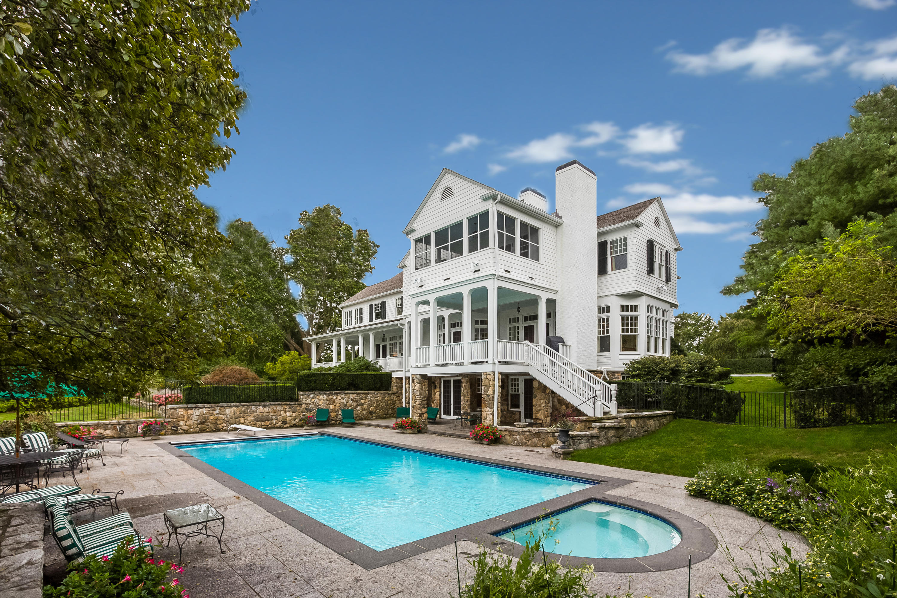 155 Long Neck Point Road Darien, CT 06820 - Photo 40 of 52 a view of a house with pool yard and a chairs