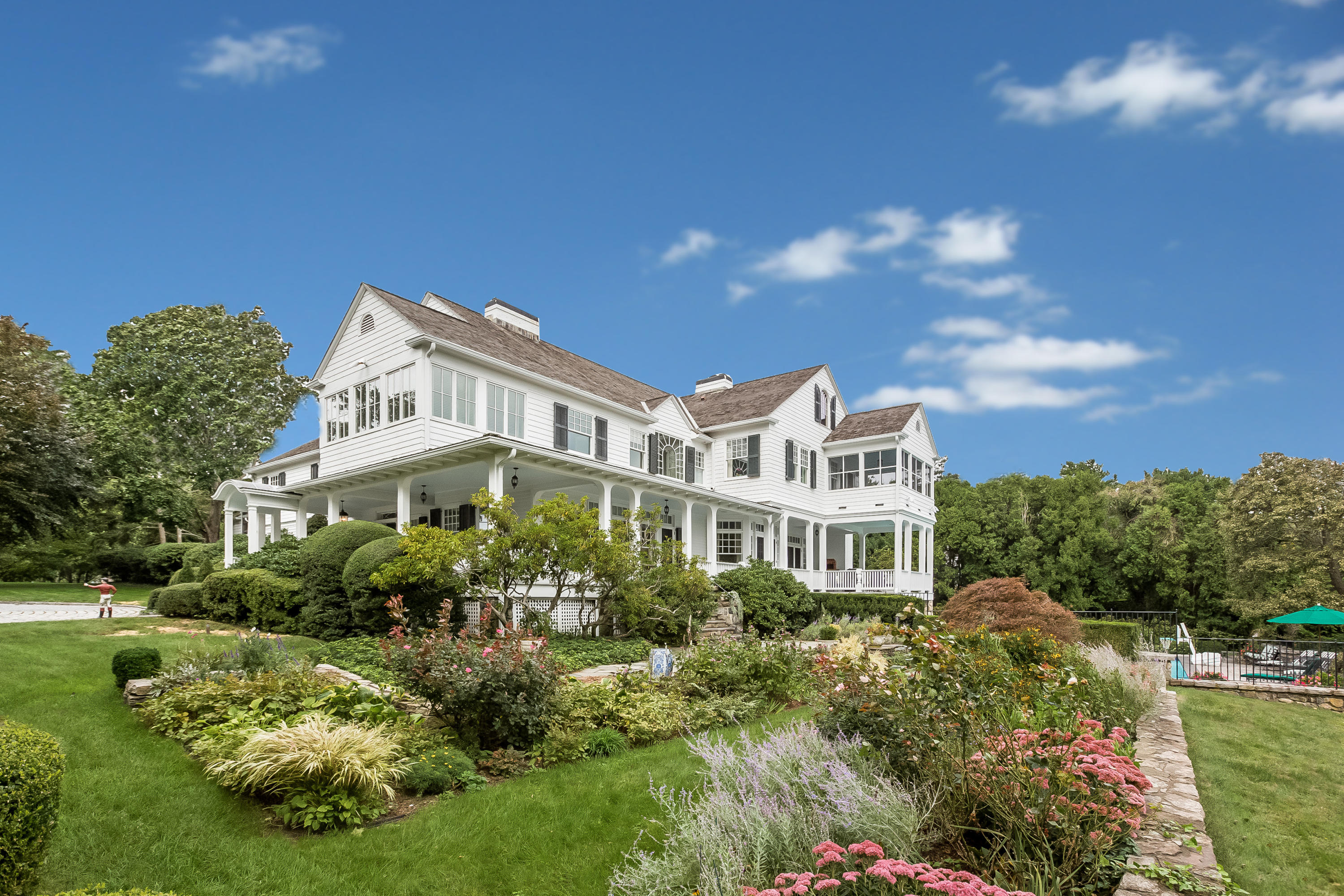 155 Long Neck Point Road Darien, CT 06820 - Photo 42 of 52 a view of a house with a yard and potted plants