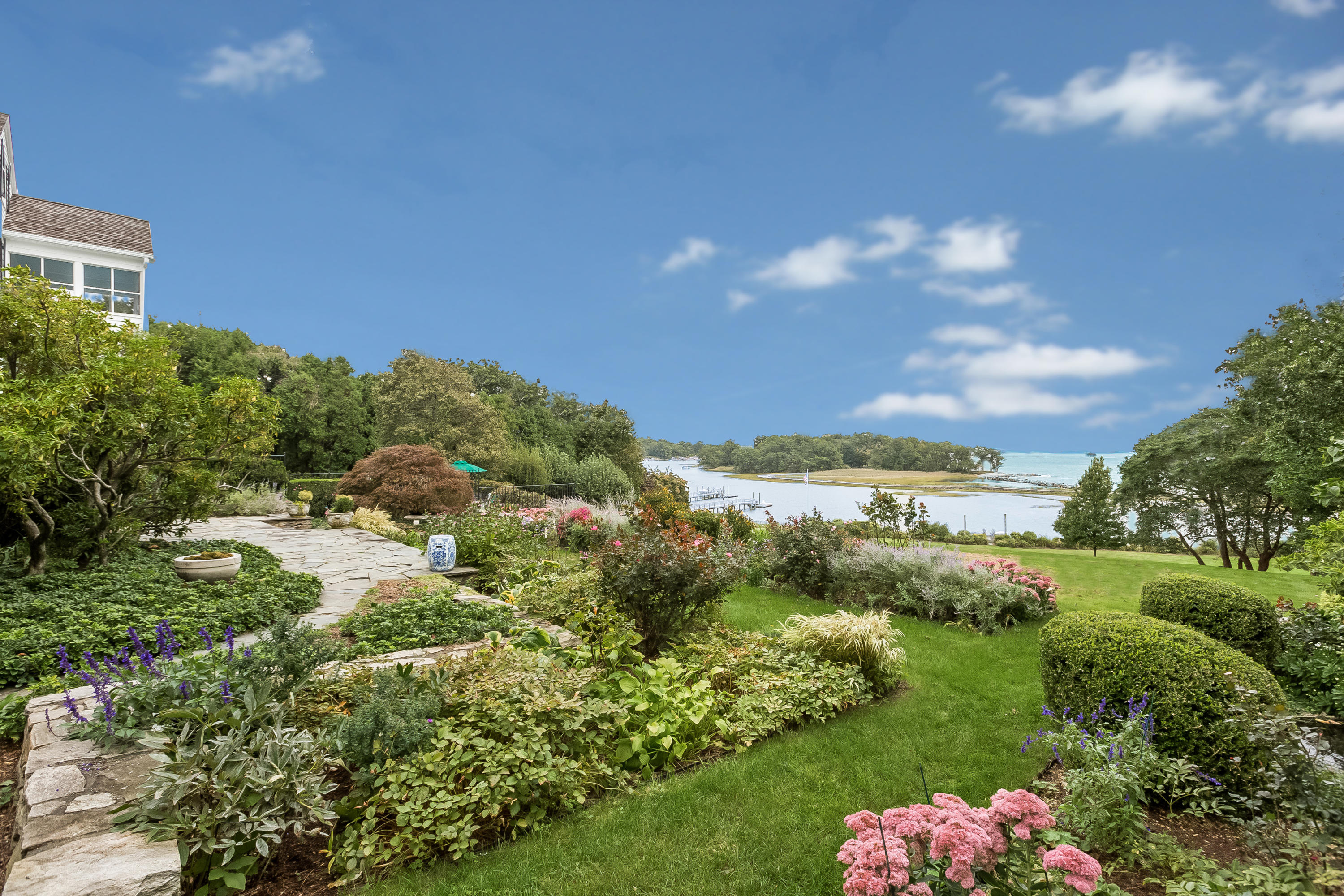 155 Long Neck Point Road Darien, CT 06820 - Photo 43 of 52 a view of a lake with a garden