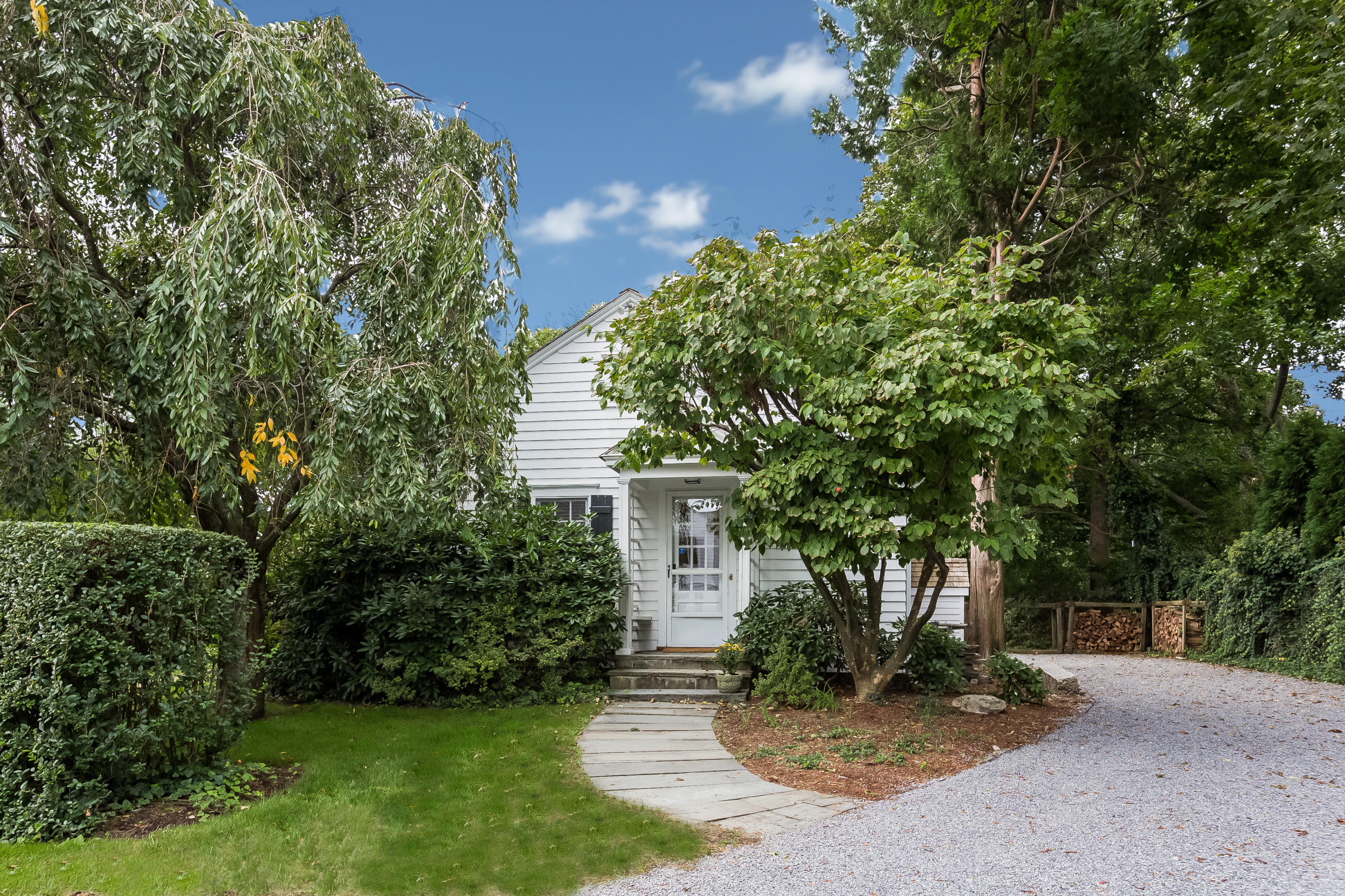 155 Long Neck Point Road Darien, CT 06820 - Photo 46 of 52 front view of a house with a yard