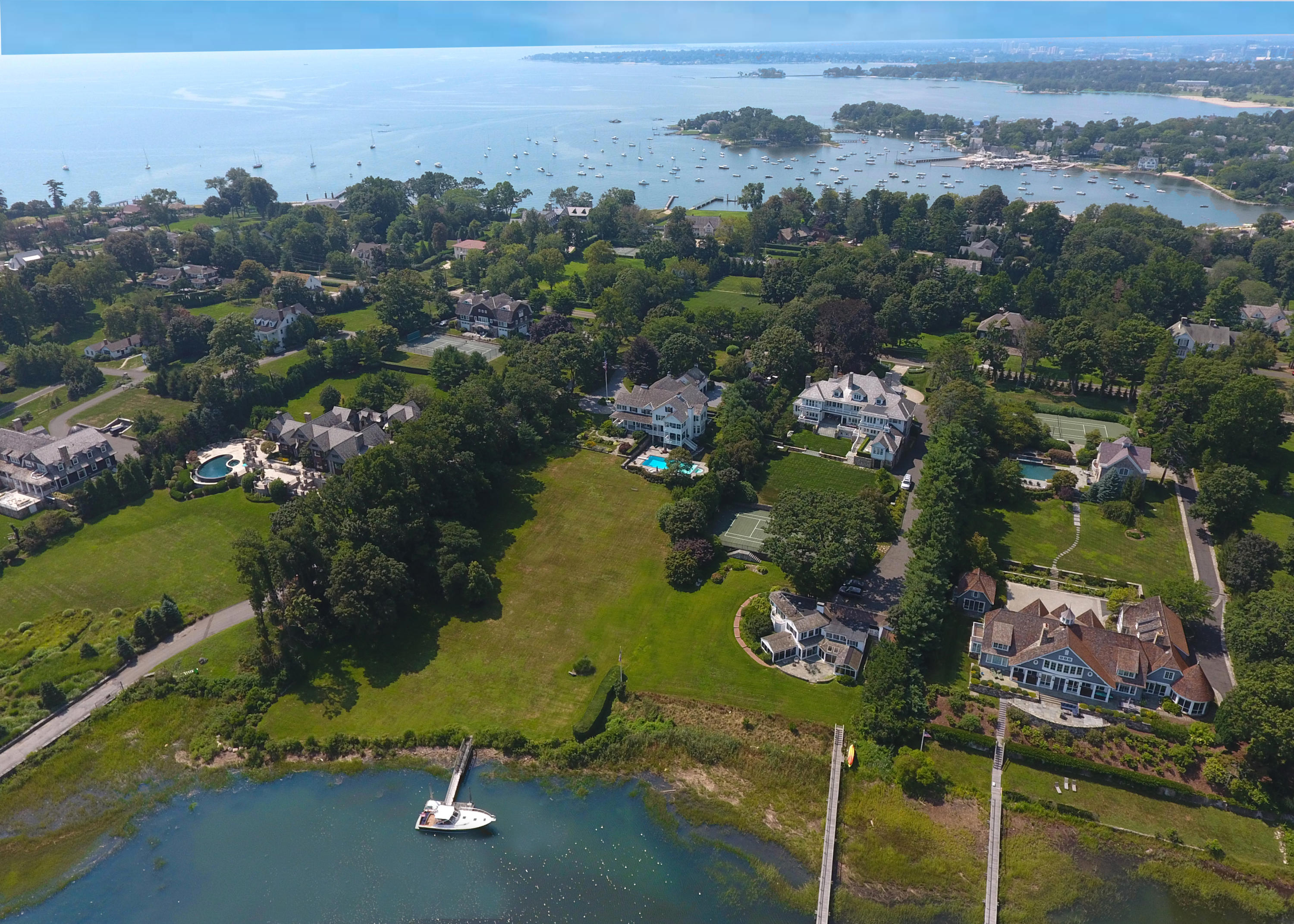 155 Long Neck Point Road Darien, CT 06820 - Photo 47 of 52 an aerial view of a houses with a yard