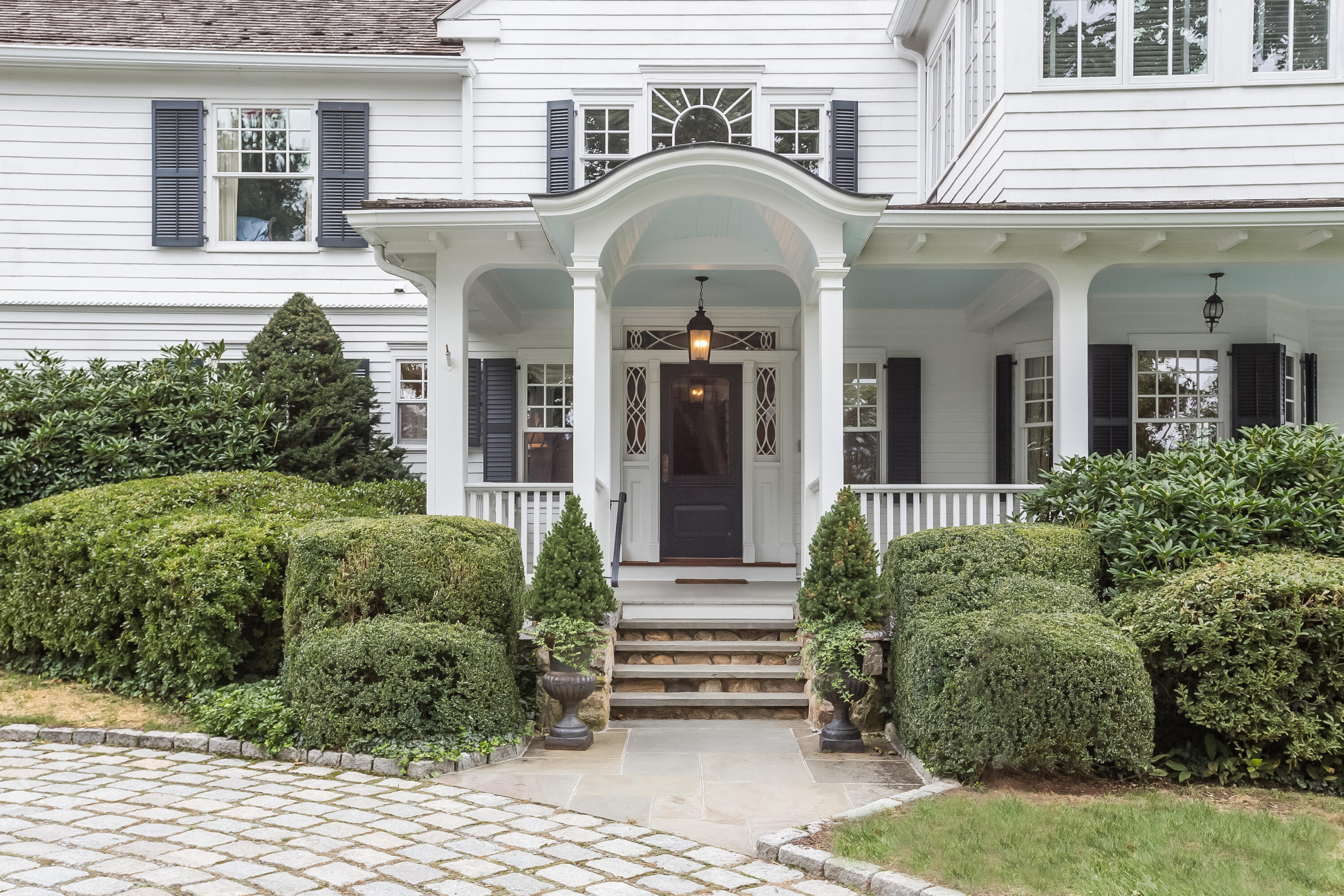 155 Long Neck Point Road Darien, CT 06820 - Photo 6 of 52 a view of a brick house with potted plants
